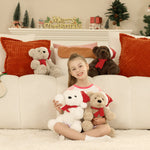 Young girl sitting on a couch with Christmas-themed teddy bears and decorations.