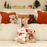 Young girl sitting on a couch with Christmas-themed teddy bears and decorations.