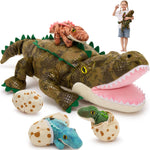 Large plush alligator toy with smaller plush dinosaurs and eggs on a white background