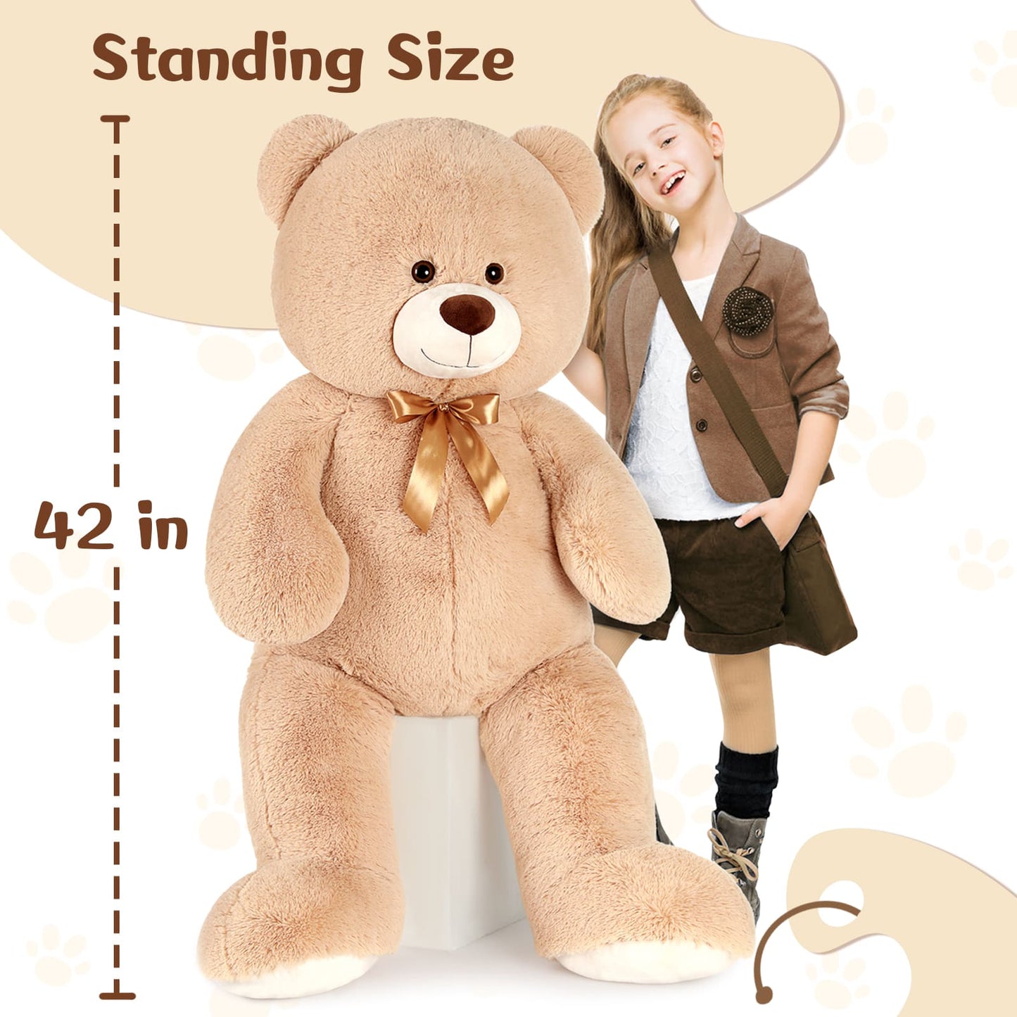 Large teddy bear with a girl standing next to it, showing the bear's height.