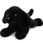 Black plush dog toy on a white background