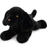 Black plush dog toy on a white background