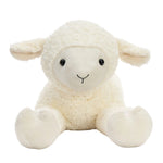 A fluffy cream-colored plush lamb toy with a soft textured fleece body, small black eyes, and a simple embroidered smile, sitting against a clean white background.